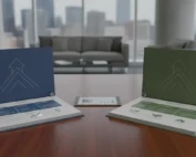 Two real estate investing coaching program binders and a tablet on a conference table.